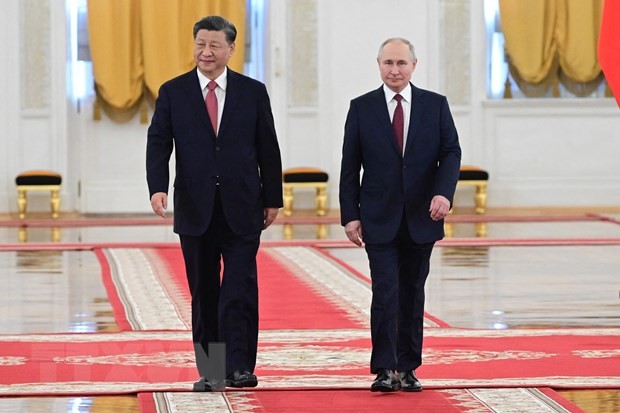 Chủ tịch Trung Quốc Tập Cận Bình (trái) và Tổng thống Nga Vladimir Putin tại Điện Kremlin ở Moskva tối 21-3. (Ảnh: AFP/TTXVN)