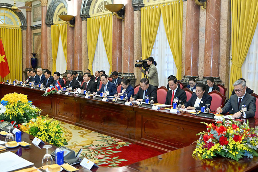 Các đại biểu Lào tại cuộc hội kiến. (Ảnh: THỦY NGUYÊN)