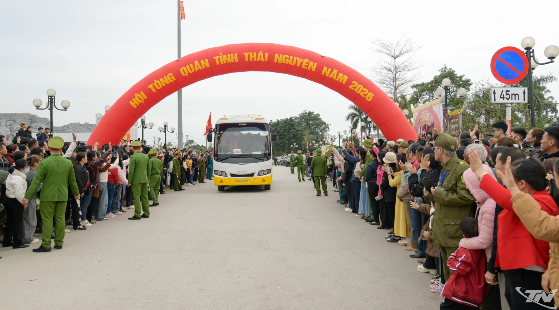 Local residents see off the new recruits as they leave for military service.