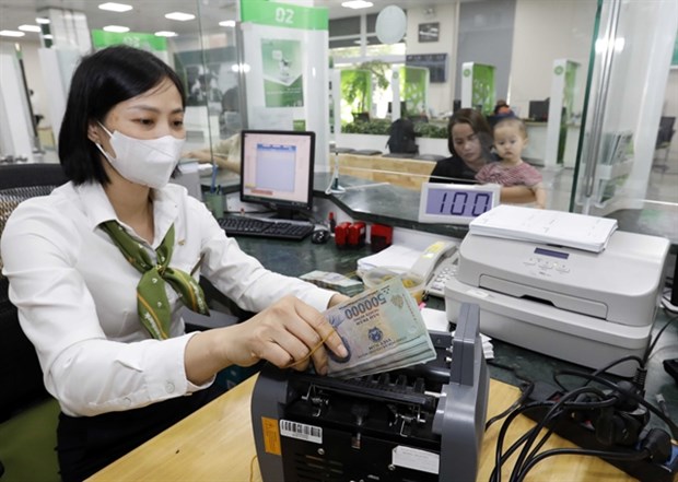 Deposits at banks reached a record high of more than 6.44 quadrillion VND as of the end of September, representing a rise of 9.95% against the end of 2022. (Photo: VNA)